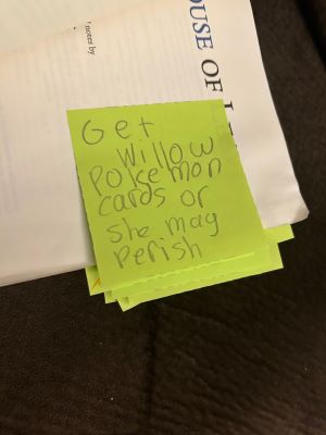 House of Leaves book with a yellow post it note reading "Get Willow pokemon cards or she may perish"